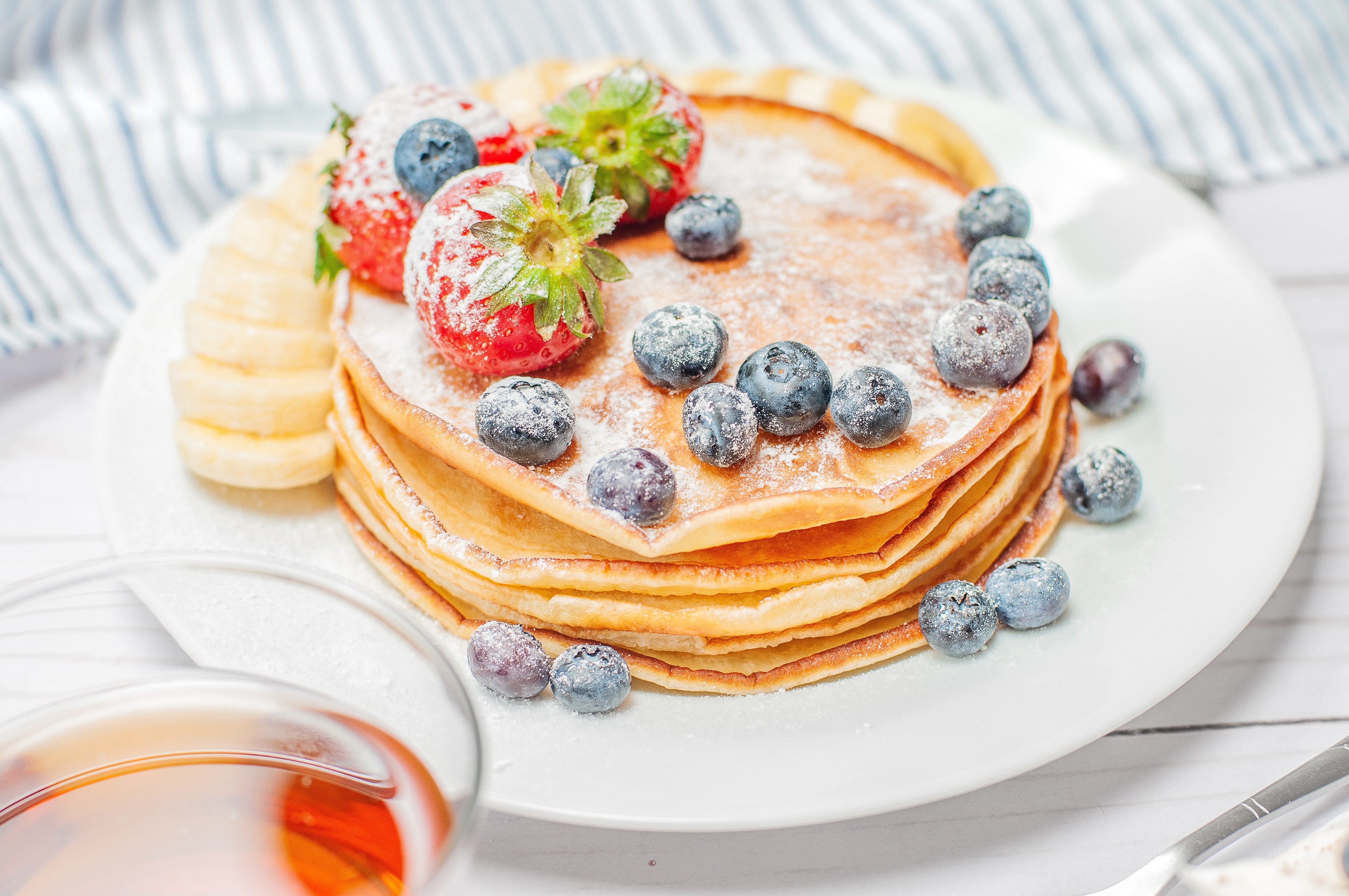 pancakes with berries on white plate 2732664